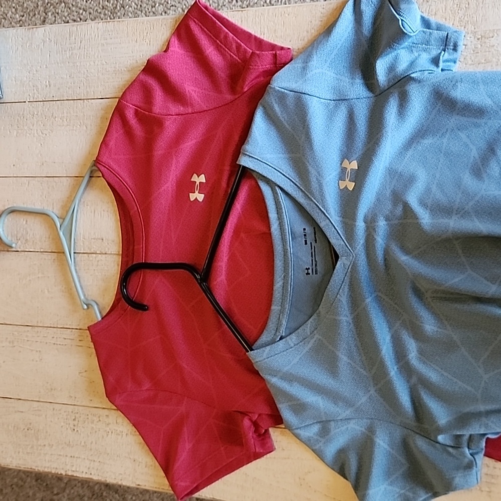 Two ladies Under Armour shirts size medium